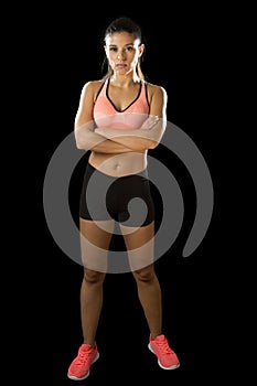 Latin sport woman posing in fierce and badass face expression with fit slim body