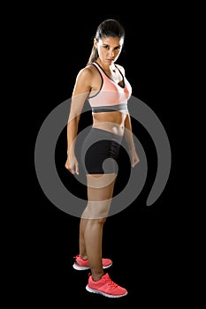 Latin sport woman posing in fierce and badass face expression with fit slim body