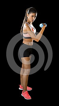 Latin sport woman posing in fierce expression holding dumbbell hand weigh