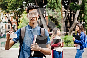 Latin student, Hispanic Man in Mexico and group of mexican students at Background in Mexico