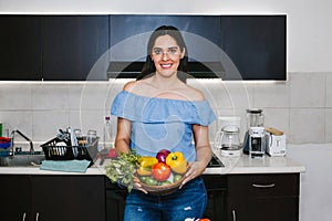 Latin woman cooking healthy food in a mexican kitchen in Mexico city