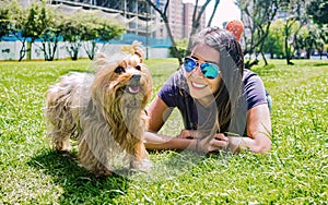 Latin woman with her faithful canine friend Yorkshire Terrier