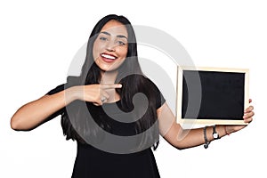 Latin woman holding chalkboard.