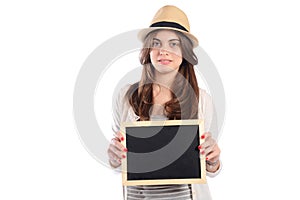 Latin woman holding chalkboard.