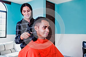 Latin woman who owns her haircut business in Mexico city