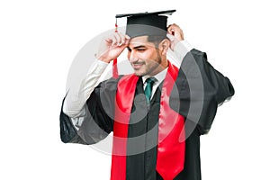Latin young man preparing for his graduation ceremony