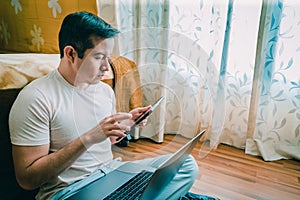 Latin young man working from home, teleworking