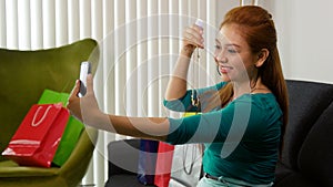 Latina Girl With Shopping Bags Taking Selfie With Phone