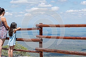 Latina mother and daughter enjoy the views