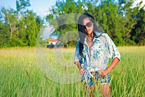 Latina woman with sunglasses and shorts