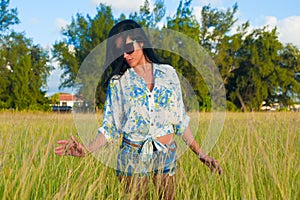 Latina woman with sunglasses and shorts