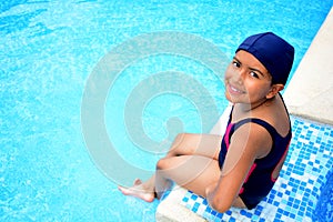 Latinamerican girl in the swimming pool.