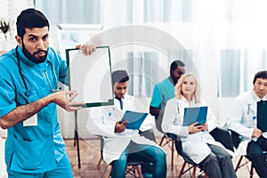 Latine Doctor With Paper Notes. Doctor`s Meeting.