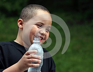 Latino boy with bottle