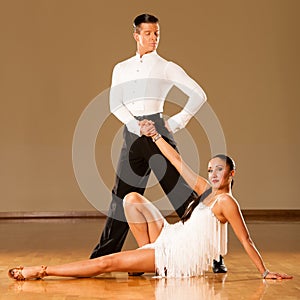 Latino dance couple in action - dancing wild samba
