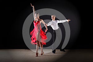 Latino dancers in ballroom