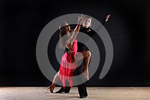 Latino dancers in ballroom