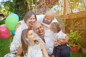 Latino family have fun on garden photo