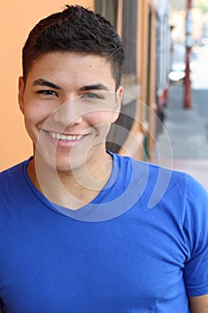 Latino male smiling headshot outdoors