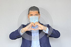 Latino man with clinical use mouth masks for protection from covid-19 virus