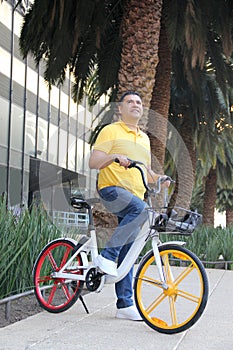 Latino men 40 years old use bicycles city transportation system tickets to avoid vehicle traffic and not contaminate them