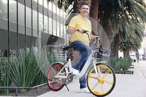 Latino men 40 years old use bicycles city transportation system tickets to avoid vehicle traffic and not contaminate them