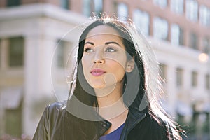 Latinx Girl Looks Towards the Horizon - Urban - Hope - Concept - Success - Outdoors photo