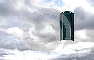Floating Porta-Potty in Cloudy Bright Sky photo