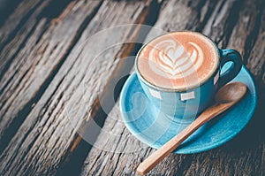 Latte art, Blue coffee cup on wooden background