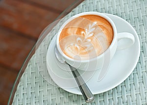 Latte art on a coffee cup photo