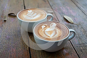 Latte art coffee with swan and heart tree shape