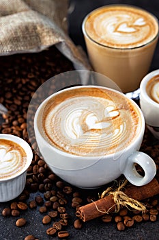 Latte art drawn on various espressos photo