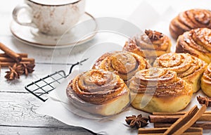Latte or cacao and Cinnamon Bun for breakfast or break on white background. Cup of coffee and homemade buns