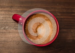 Latte Capuccino in red cup view from above