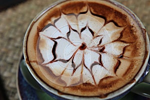 Latte coffee morning cup hot cofee top view art desigh aroma beverage with foam in ceramic mug vintage texture flower design