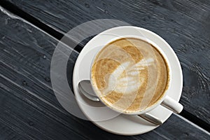 latte coffee top view on vintage dark grey wooden table background