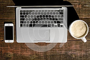 Latte Laptop and Smartphone on Wooden Picnic Table