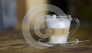 Latte on Rustic Wooden Table. Shallow depth of field. Copy space.