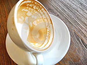 Latte's foam left at the bottom of the glass.