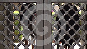 Lattice in ancient wood door in Muslim palace of Nasrid style, Alcazaba, Malaga