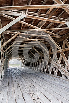The lattice infrastructure of the iconic Hogback Covered Bridge spanning the North River, Winterset, Madison County, Iowa