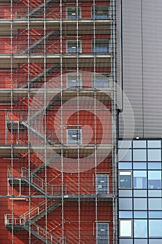 Latticed exterior staircase casts shadows