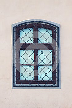 Latticed window on building wall, isolated
