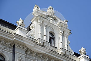 Latvia, Riga. Superstructure on a house roof in the form of jugendstil. photo