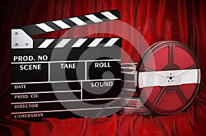 Latvian cinematography, film industry, cinema in Latvia. Clapperboard with and film reels on the red fabric, 3D rendering