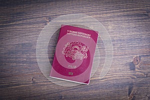 Latvian european passport on dark wood background