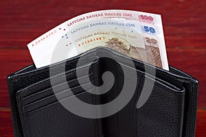 Latvian money in the black wallet