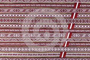 Latvian national style background with ornamented ribbons