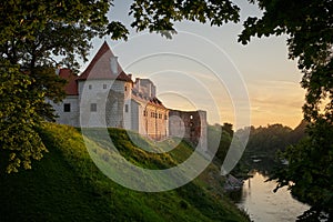 Latvian tourist landmark attraction - ruins of medieval Bauska castle and the remains of a later palace at sunset. Bauska