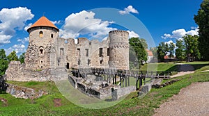 Latvian tourist landmark attraction - ruins of the medieval castle, stone walls and towers in old Cesis town, Latvia